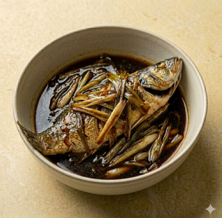 Branzino brasato con cipollotti