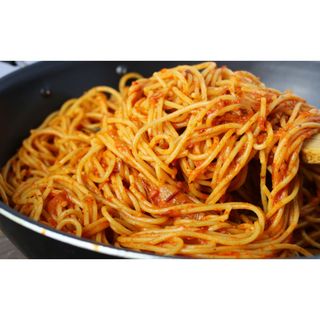 Jollof Spaghetti served along with meat and plantain