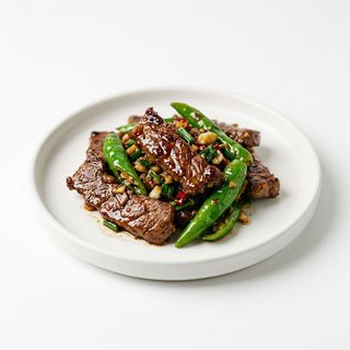 Manzo saltato con peperoncini verdi青椒炒牛肉