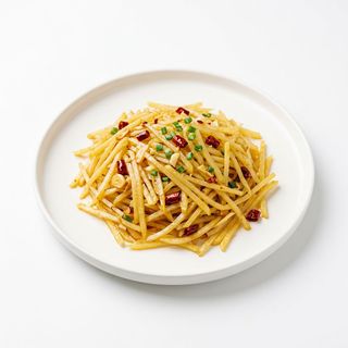 Patate grattugiate saltate agropiccanti