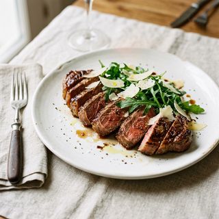 Tagliata con rucola e grana