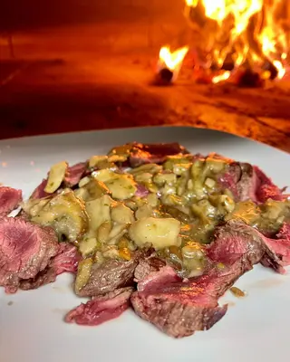 Tagliata di manzo con funghi porcini trifolati