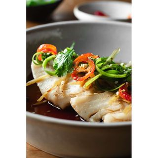 Whole steamed fish fillet in garlic sauce