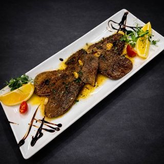 Телешки език в маслено-винен сос