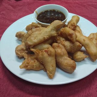 65. Пиле деликатес панирани хапки с пикантен сос (700гр)