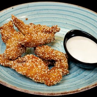 Панирани пилешки хапки със сусам (250г)