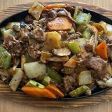 100. Телешко върху метална плоча (800г)