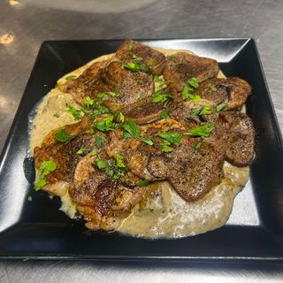 Телешки език със сос от манатарки