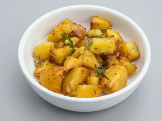 Patatas horneadas con romero - racion de 300gr aprox.