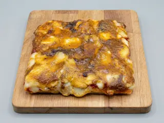 Pizza pesto siciliano (porción)