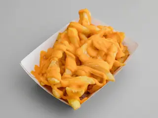 Patatas rústicas con salsa cheddar