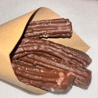 Churros Cubiertos de Chocolate con leche (4 Unidades)