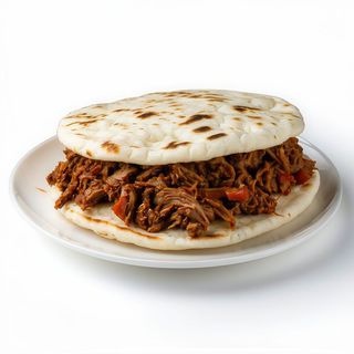 Arepa de Ternera y cebolla caramelizada