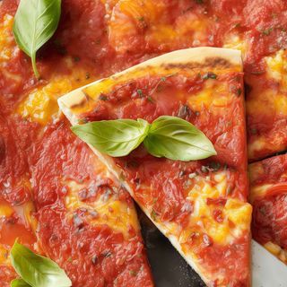 Pizza MARINARA  tomate ,tomate cherry , orégano alcaparras y ajo