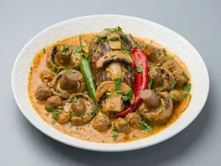 Ternera con salsa de champiñones naturales