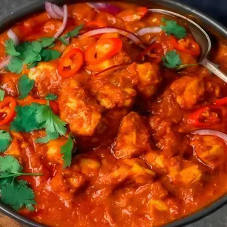 Cordero balti con garbanzos