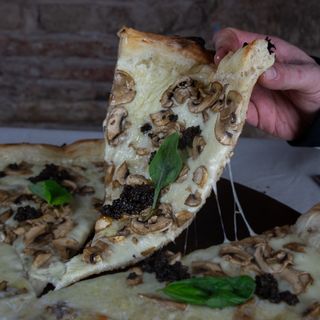 Porción Pizza Trufa y Champis