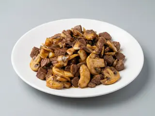 Ternera Con Champiñones