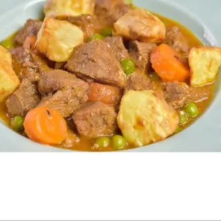 Secreto de cerdo guisado con patata al caliu