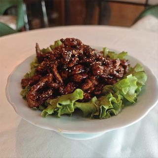 Tiras de pechuga de pollo caramelizado a la naranja y miel