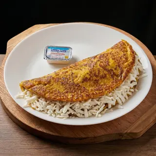 Cachapa con queso rallado y mantequilla