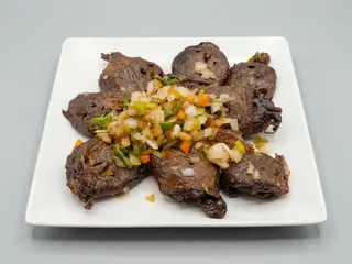 Cabeza De Pato A La Pimienta Y Sal