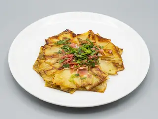 Alcachofa confitada con jamón