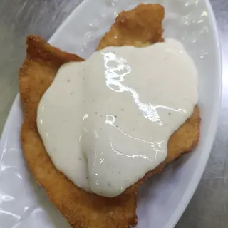 Escalope de pollo en salsa de queso