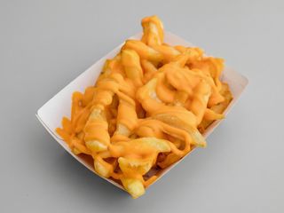 Patatas rústicas con salsa cheddar 