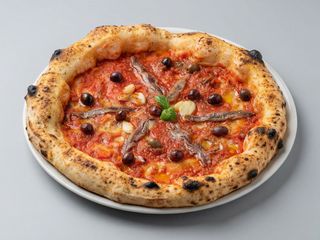 Pizza puttanesca alici aglio olive nere e origano 