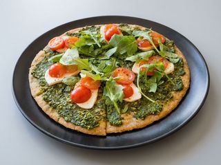 Flatbread with Basil Pesto, Tomatoes and homemade cashew mozzarella 
