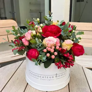 Box of assorted red and white flowers