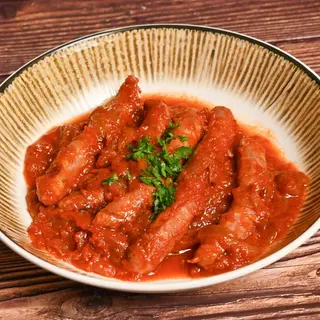 Salchichas con tomate