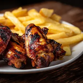 RACION DE ALITAS A LA PARRILLA DE LEÑA