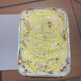 Plato con queso  gratinado de pollo