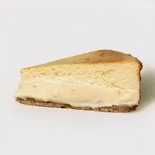 Tarta de queso de avellana tostada y chocolate blanco · Porción