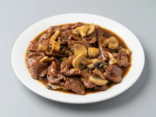 57. Ternera champiñones