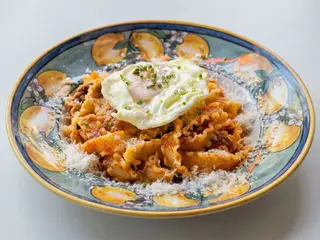 Raviolis con ragú a la bolonyesa