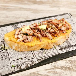 Tosta de pulpito braseado a la gallega