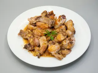 Carne De Conejo Al Ajillo