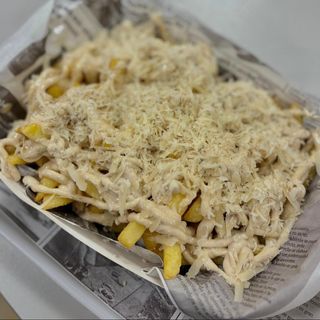 Patatas parmesanas con salsa de trufa