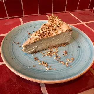 Porción de Cheese cake de Pistacho