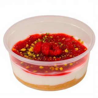 Cheesecake de Limón con Coulis de Fresa y Pistacho