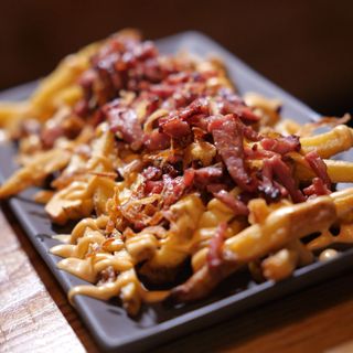 Patatas bacon lovers 1/2 ración