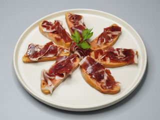 Pan con tumaca y jamón serrano pata negra (ud.)
