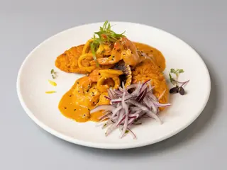 Tacu tacu con salsa de mariscos