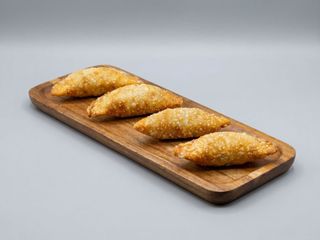 Empanadilla de espinacas y queso rulo de cabra. Unidad.