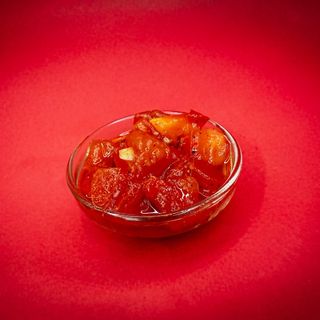 Tomates aliñados (60 ml.)