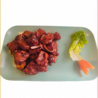 Costilla con salsa capital