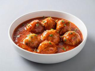 racion de albondiga con tomate 